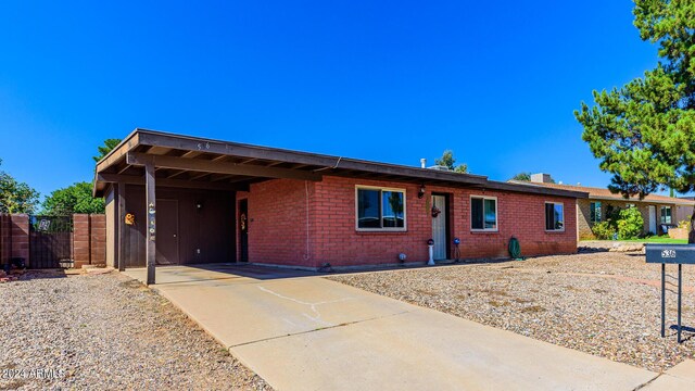 ranch-style house with a carport