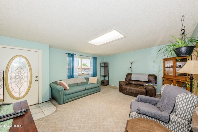 carpeted living room featuring a textured ceiling