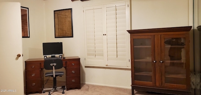 office area with light colored carpet