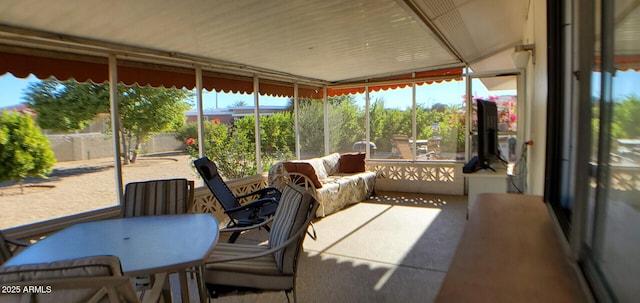 sunroom / solarium featuring a healthy amount of sunlight