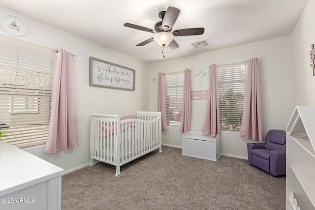 bedroom with carpet, baseboards, visible vents, and a nursery area