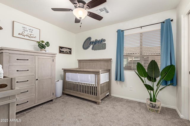 bedroom featuring a ceiling fan, light colored carpet, visible vents, and baseboards