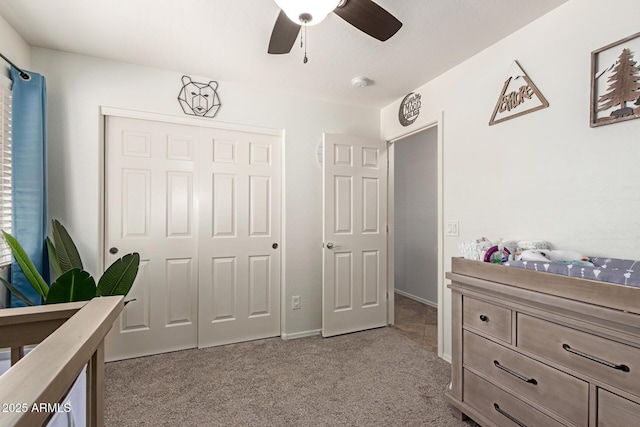 carpeted bedroom with a closet and ceiling fan