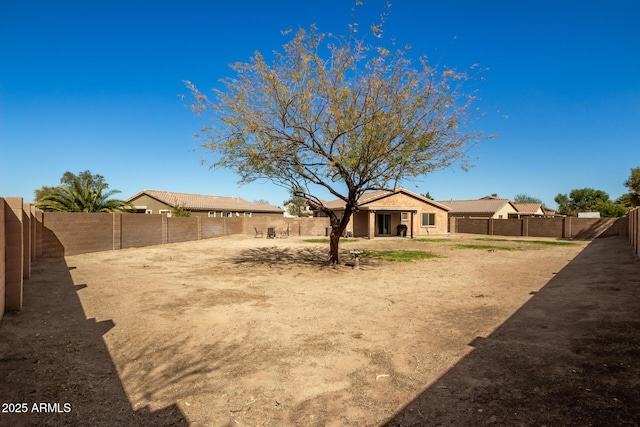 view of yard with a fenced backyard and a patio