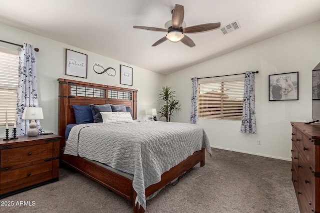 bedroom featuring lofted ceiling, multiple windows, visible vents, and carpet flooring