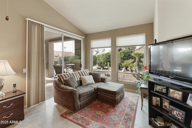 living room featuring vaulted ceiling and a wealth of natural light