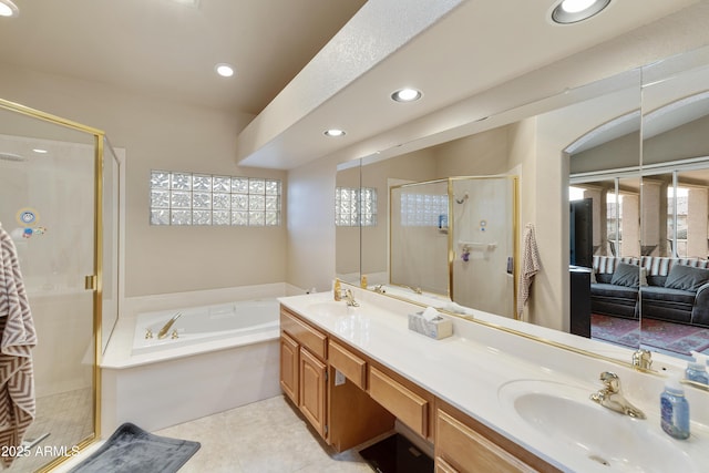 bathroom featuring tile patterned floors, vanity, and separate shower and tub