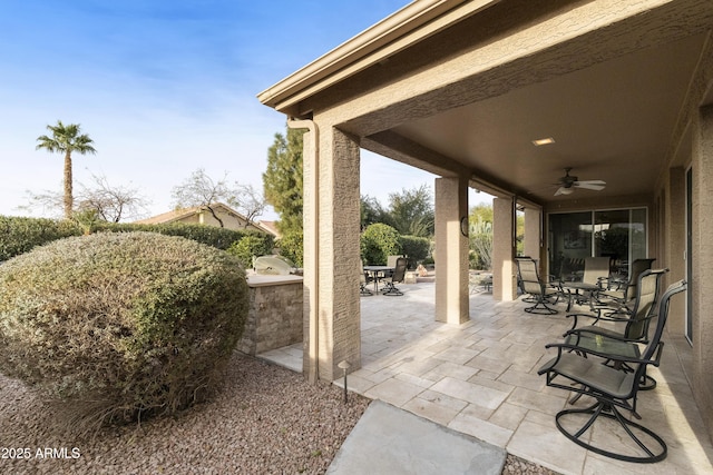 view of patio with ceiling fan