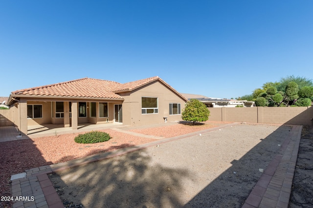 back of house with a patio