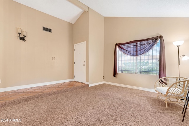 unfurnished room with tile patterned flooring and vaulted ceiling