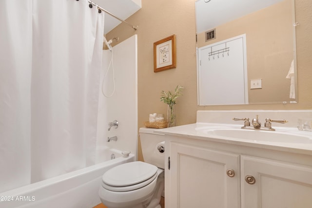 full bathroom featuring shower / bath combo, vanity, and toilet