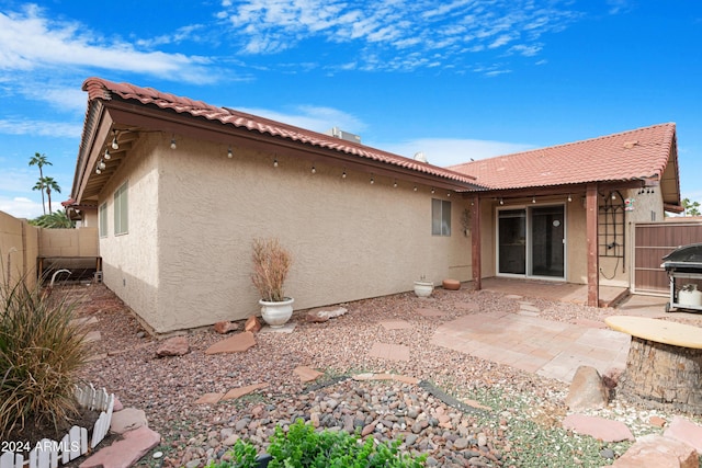 rear view of property with a patio