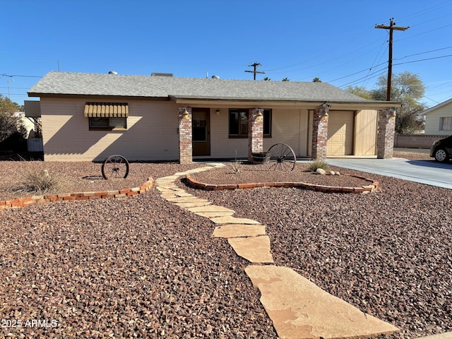 ranch-style house featuring a garage