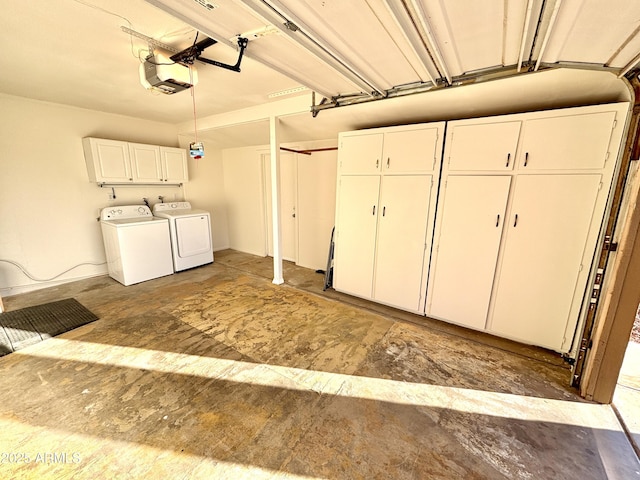 garage featuring independent washer and dryer and a garage door opener