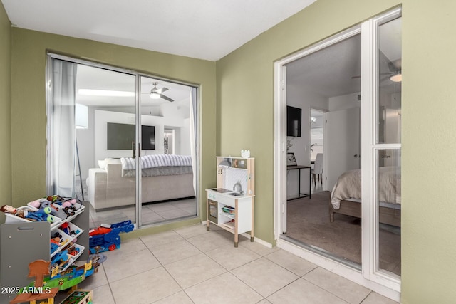bedroom with a closet and light tile patterned floors