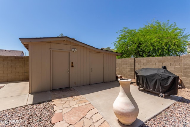 view of shed featuring a fenced backyard