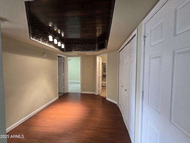 interior space featuring wood finished floors and baseboards