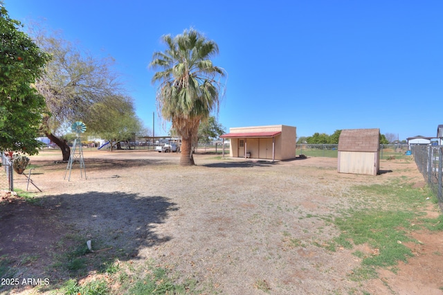 18622 E Via De Arboles, Queen Creek, AZ 85142 - view of yard featuring an outbuilding, a shed, and fence