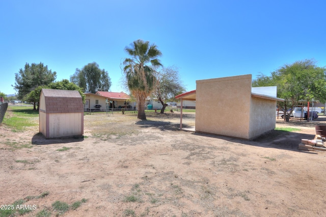 18622 E Via De Arboles, Queen Creek, AZ 85142 - view of yard featuring fence, an outdoor structure, and a shed