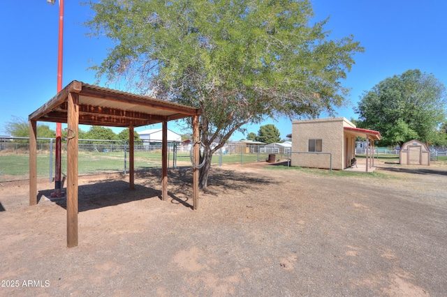 18622 E Via De Arboles, Queen Creek, AZ 85142 - view of yard featuring a storage unit, an outdoor structure, and fence