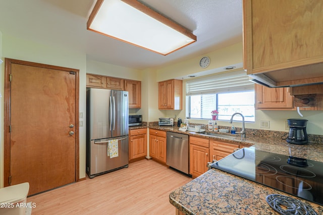 18622 E Via De Arboles, Queen Creek, AZ 85142 - kitchen with light wood finished floors, stainless steel appliances, and a sink