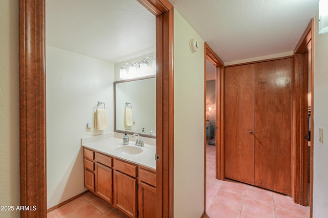 18622 E Via De Arboles, Queen Creek, AZ 85142 - bathroom featuring a textured ceiling, vanity, and tile patterned flooring