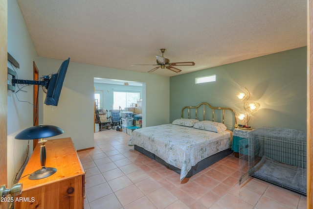 18622 E Via De Arboles, Queen Creek, AZ 85142 - bedroom with light tile patterned flooring, a textured ceiling, and a ceiling fan