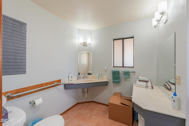 18622 E Via De Arboles, Queen Creek, AZ 85142 - half bath featuring tile patterned floors, toilet, baseboards, and a sink