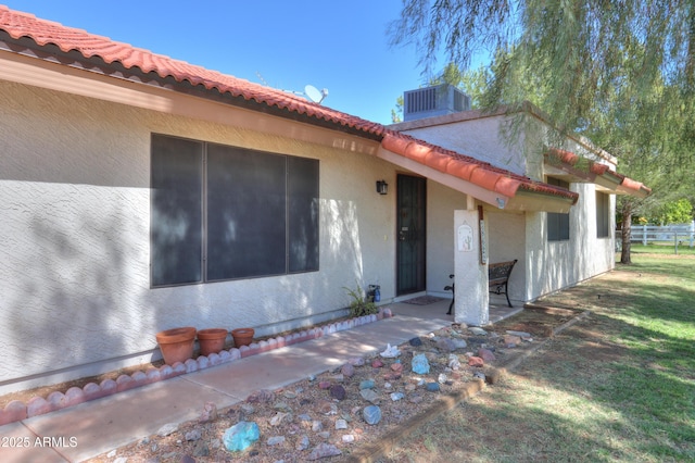 18622 E Via De Arboles, Queen Creek, AZ 85142 - exterior space featuring stucco siding, cooling unit, and a tiled roof