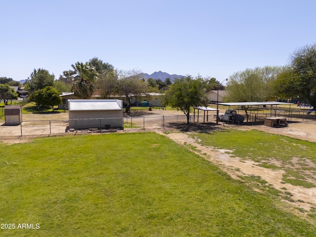 18622 E Via De Arboles, Queen Creek, AZ 85142 - view of yard with an outdoor structure, fence, and a mountain view