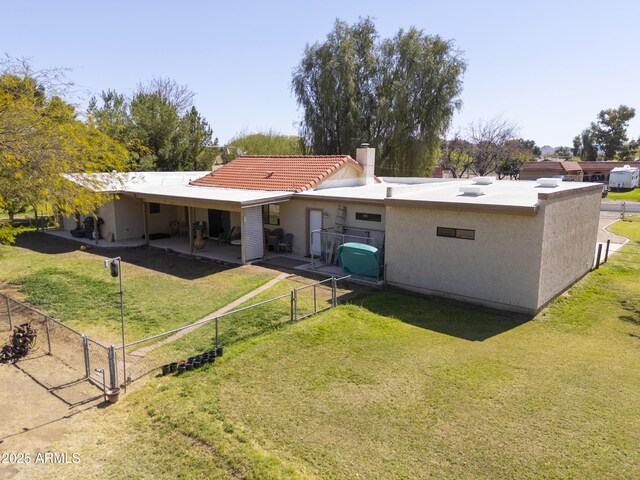 18622 E Via De Arboles, Queen Creek, AZ 85142 - rear view of house with a gate, a patio area, and a lawn