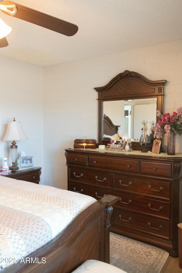 bedroom featuring ceiling fan and wood finished floors