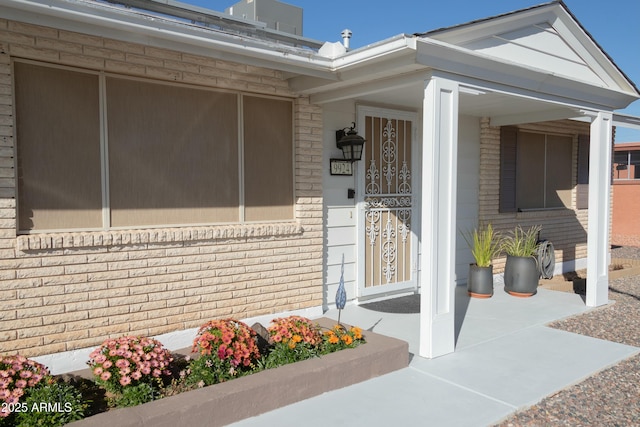 property entrance featuring covered porch