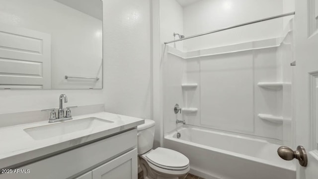 bathroom with vanity, toilet, and bathtub / shower combination