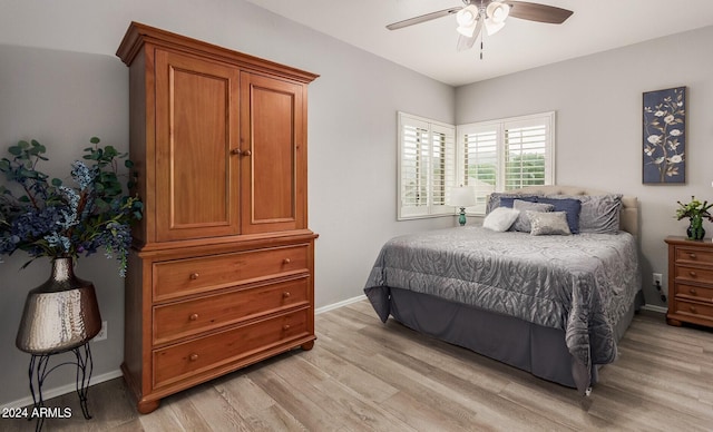 bedroom featuring ceiling fan and light hardwood / wood-style floors