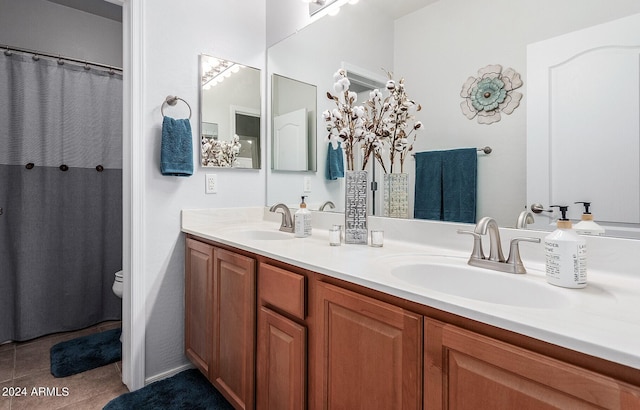 bathroom featuring vanity, toilet, and tile patterned floors