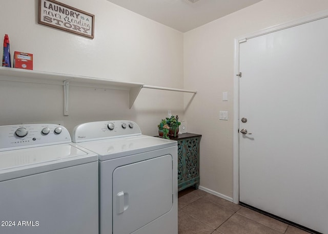 laundry area featuring independent washer and dryer and light tile patterned flooring