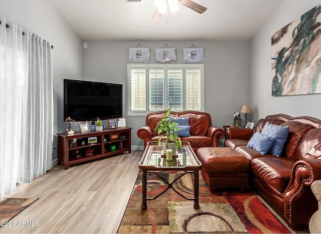 living room with light wood-type flooring and ceiling fan