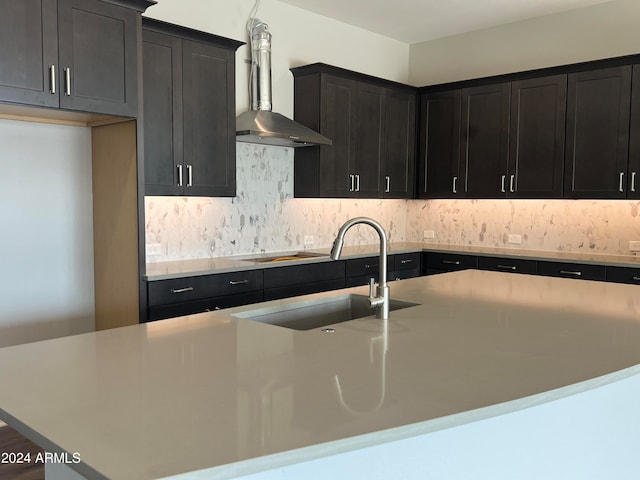 kitchen featuring decorative backsplash, sink, wall chimney range hood, and black electric cooktop