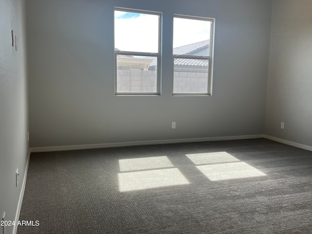 unfurnished room featuring carpet flooring