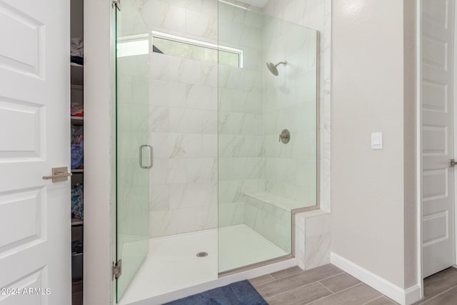 bathroom featuring an enclosed shower