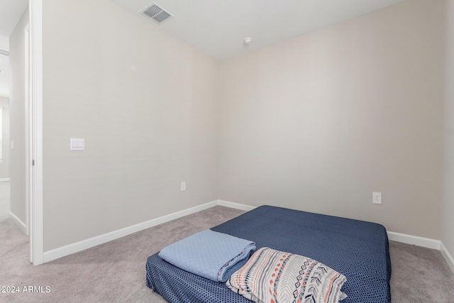 bedroom with light carpet