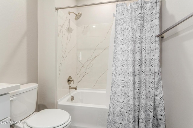 bathroom with shower / tub combo and toilet