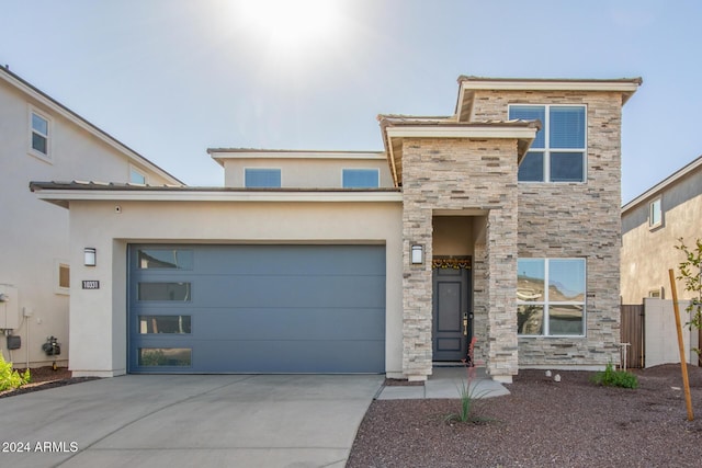 view of front of home with a garage