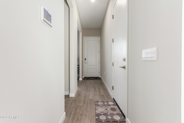 corridor featuring light wood-type flooring