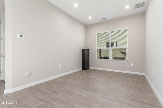 unfurnished room with light hardwood / wood-style floors