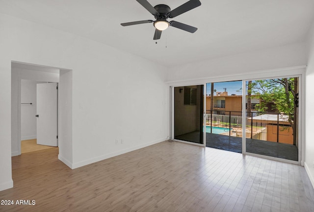 6125 E Indian School Rd Unit 240, Scottsdale, AZ 85251 - unfurnished room with wood finished floors, baseboards, and ceiling fan