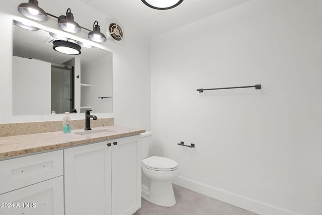 6125 E Indian School Rd Unit 240, Scottsdale, AZ 85251 - bathroom with toilet, vanity, and baseboards