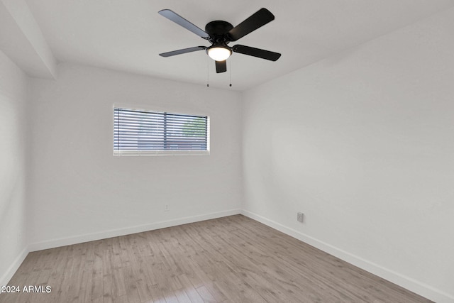 6125 E Indian School Rd Unit 240, Scottsdale, AZ 85251 - unfurnished room featuring light wood-type flooring, baseboards, and ceiling fan