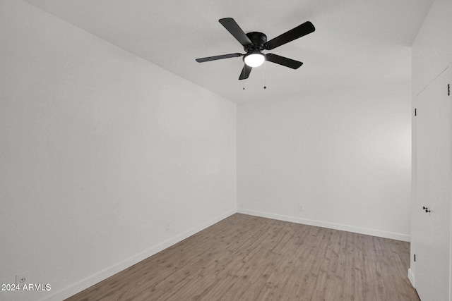 6125 E Indian School Rd Unit 240, Scottsdale, AZ 85251 - unfurnished room with wood finished floors, baseboards, and a ceiling fan
